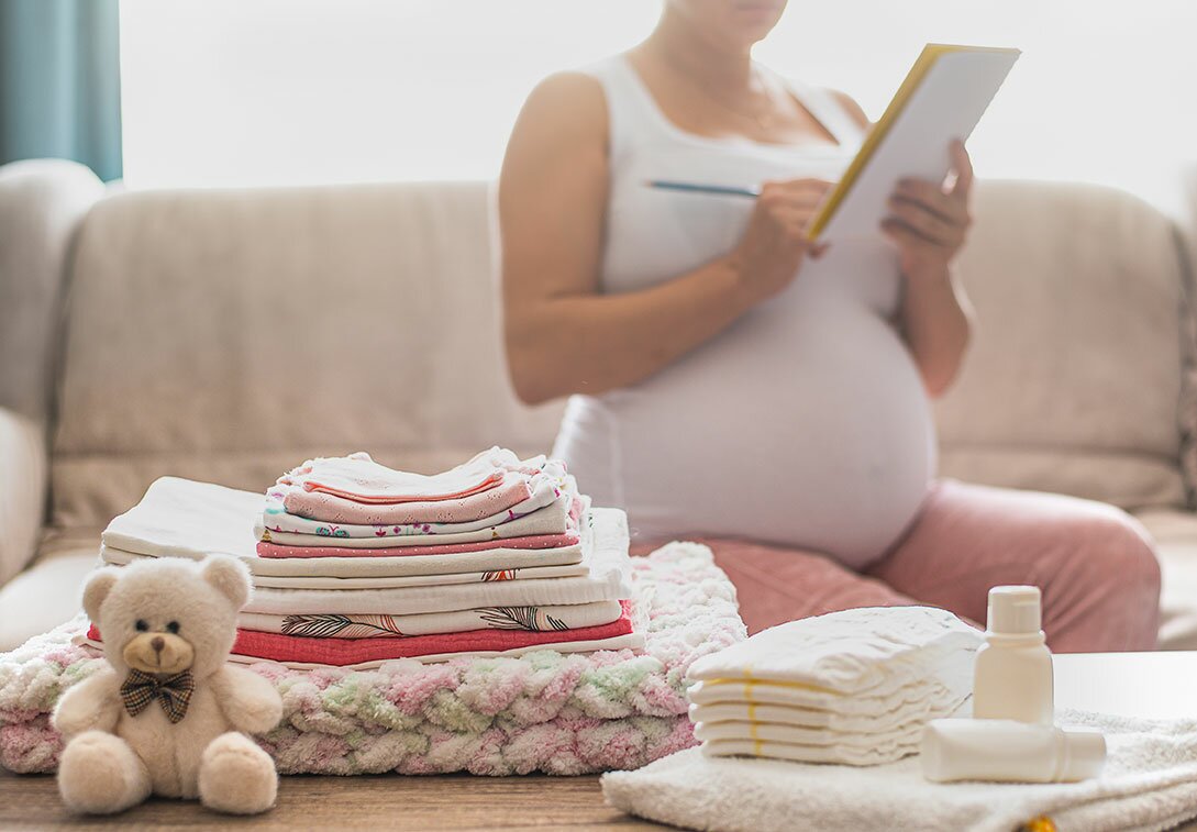 Pregnant woman packing a hospital bag
